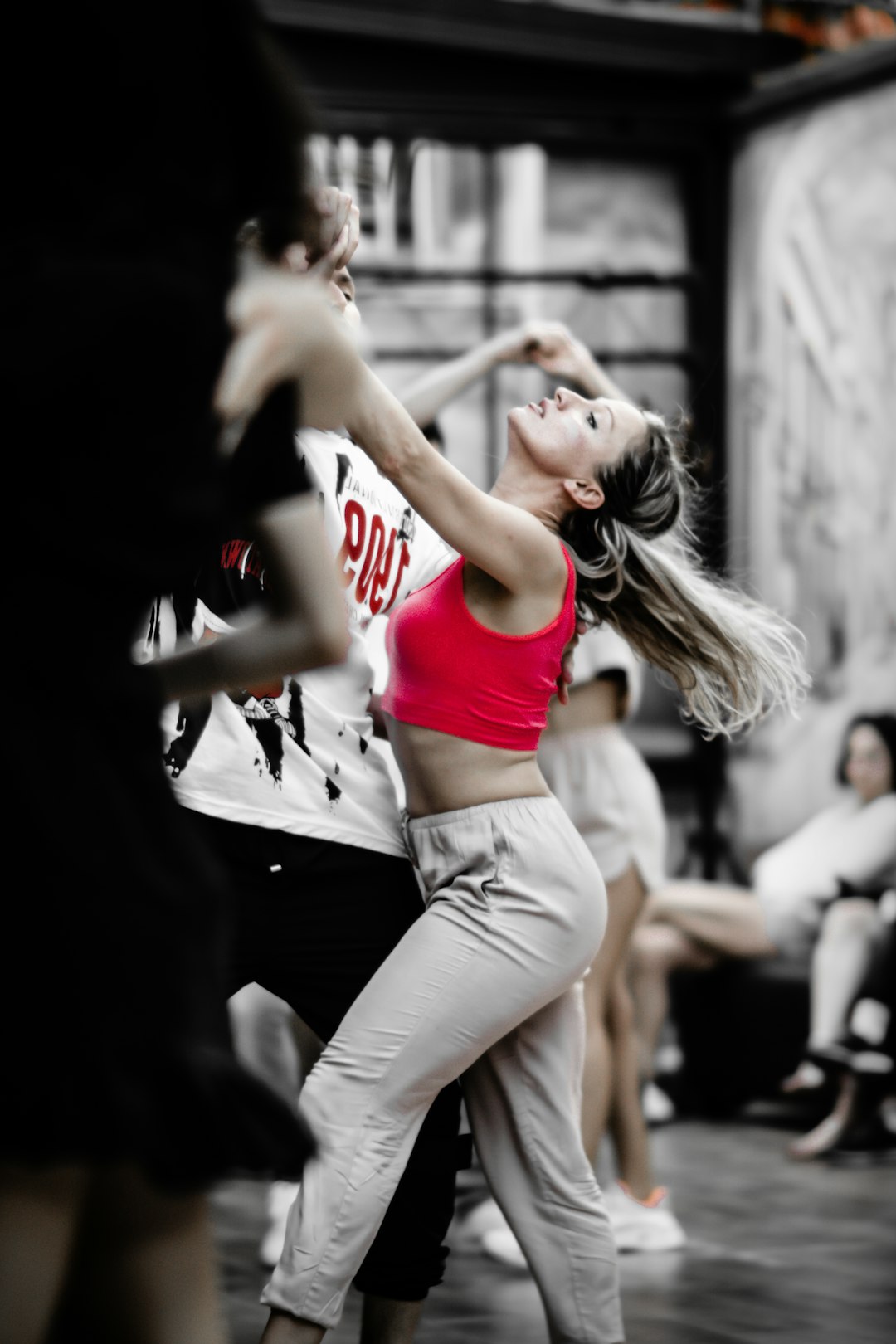 a-woman-in-a-red-top-is-dancing-wpsn-97af3o