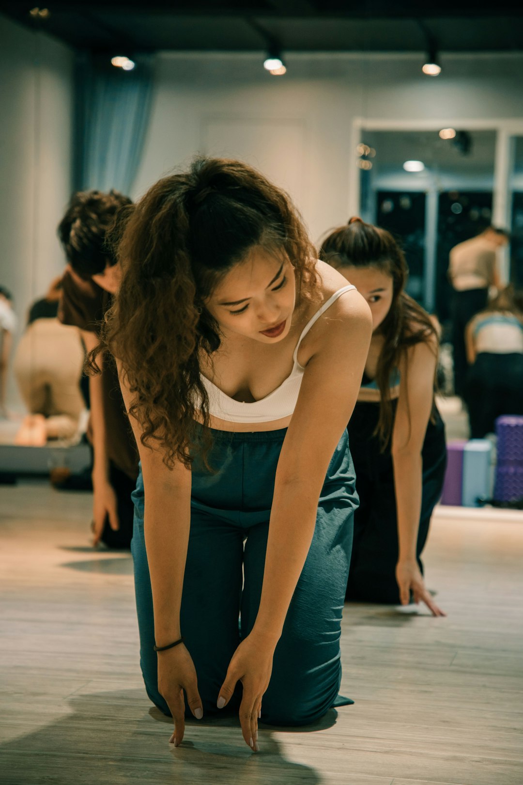 woman-in-blue-tank-top-and-blue-denim-jeans-sitting-on-floor-pfjpjlsttli